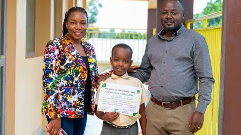 Awarding outgoing prefect (Agaba Marcus)
