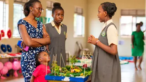 Kayelen explaining tour to Maama Karen