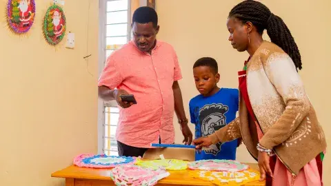 Proud parent, Muhangi family