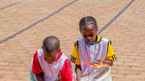 Sack race and button fixing